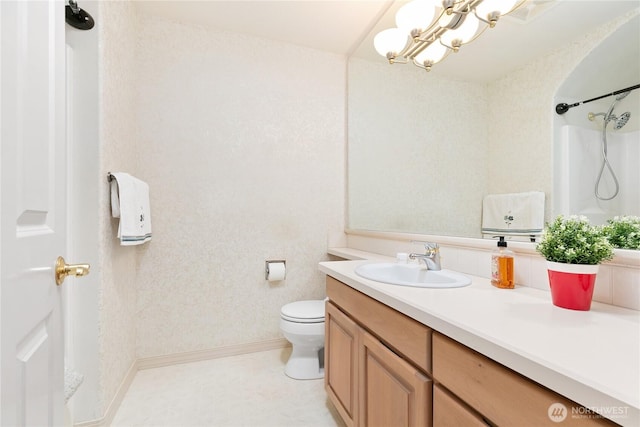 412 N 69th Ave, Yakima, WA 98908 - bathroom featuring vanity, toilet, a shower, baseboards, and a chandelier