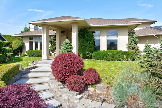 412 N 69th Ave, Yakima, WA 98908 - view of front of house with stucco siding, a front lawn, and a shingled roof