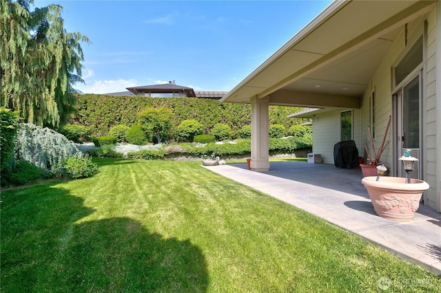 412 N 69th Ave, Yakima, WA 98908 - view of green lawn with a patio area
