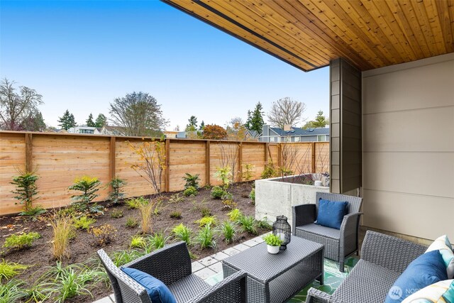 9217B Densmore Ave N, Seattle, WA 98103 - fenced backyard featuring outdoor lounge area and a patio