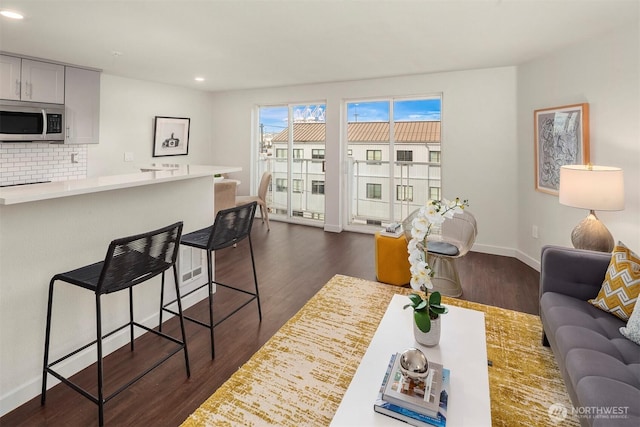 3318 30th Ave SW Unit A502, Seattle, WA 98126 - living area with recessed lighting and dark wood finished floors