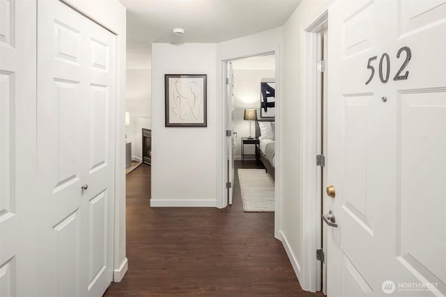 3318 30th Ave SW Unit A502, Seattle, WA 98126 - hallway with dark wood finished floors and baseboards