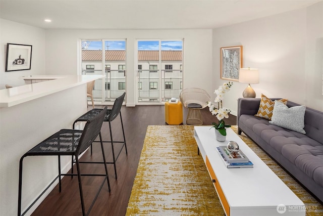3318 30th Ave SW Unit A502, Seattle, WA 98126 - living area featuring dark wood-type flooring and recessed lighting