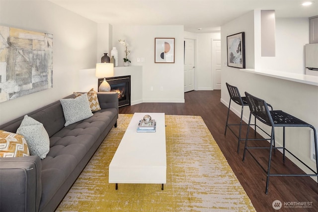 3318 30th Ave SW Unit A502, Seattle, WA 98126 - living area featuring wood finished floors and a glass covered fireplace