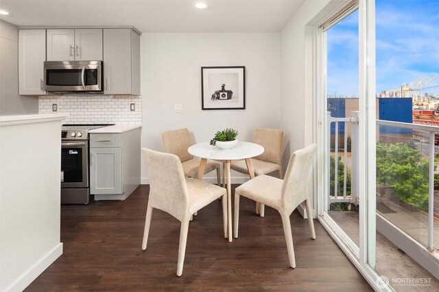 3318 30th Ave SW Unit A502, Seattle, WA 98126 - dining room featuring dark wood-style flooring and recessed lighting