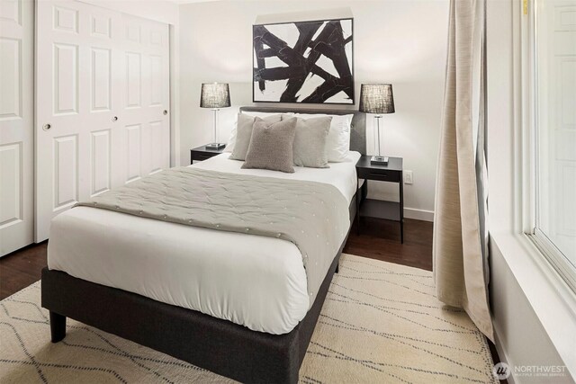 3318 30th Ave SW Unit A502, Seattle, WA 98126 - bedroom featuring wood finished floors and a closet