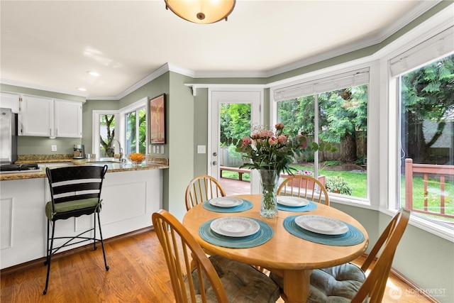 22233 NE 23rd St, Sammamish, WA 98074 - dining space with healthy amount of natural light, light wood finished floors, crown molding, and recessed lighting