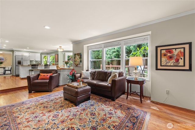 22233 NE 23rd St, Sammamish, WA 98074 - living room with crown molding, light wood-style floors, and recessed lighting