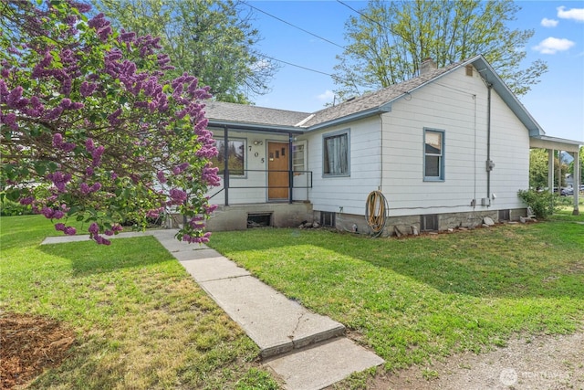 705 Old Kettle Rd, Kettle Falls, WA 99141 - ranch-style home featuring a chimney, a front lawn, and a shingled roof