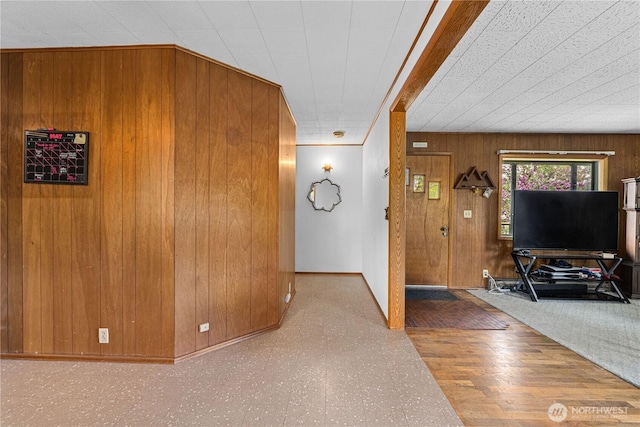705 Old Kettle Rd, Kettle Falls, WA 99141 - living room with wooden walls, tile patterned floors, and baseboards