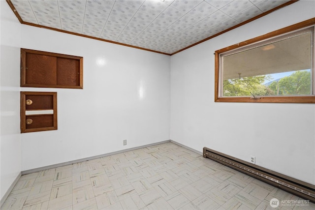 705 Old Kettle Rd, Kettle Falls, WA 99141 - empty room with crown molding, a baseboard radiator, baseboards, and light flooring