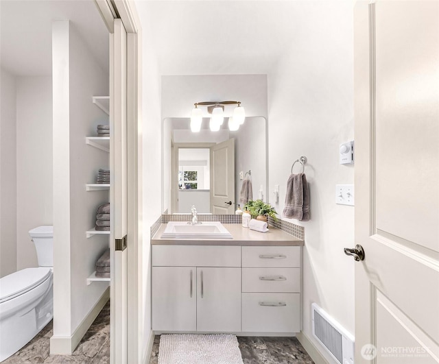 1210 Birch St, Bellingham, WA 98229 - bathroom featuring vanity, toilet, and marble look tile flooring