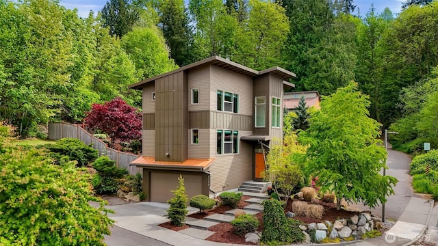 1210 Birch St, Bellingham, WA 98229 - view of front of property with driveway, an attached garage, and board and batten siding