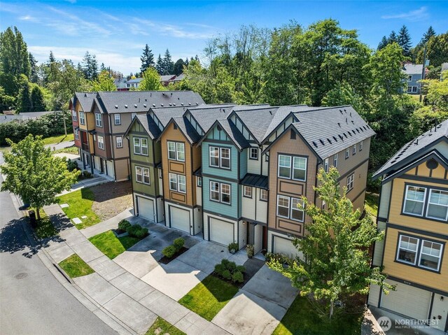 7165 27th Ave SW, Seattle, WA 98106 - multi unit property featuring driveway, a garage, and a residential view