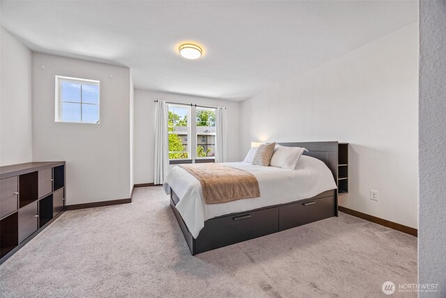 7165 27th Ave SW, Seattle, WA 98106 - bedroom featuring light colored carpet and baseboards