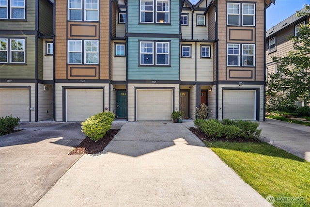 7165 27th Ave SW, Seattle, WA 98106 - townhome / multi-family property with an attached garage and driveway