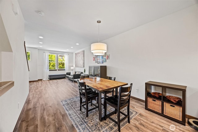 7165 27th Ave SW, Seattle, WA 98106 - dining area with wood finished floors, baseboards, and recessed lighting