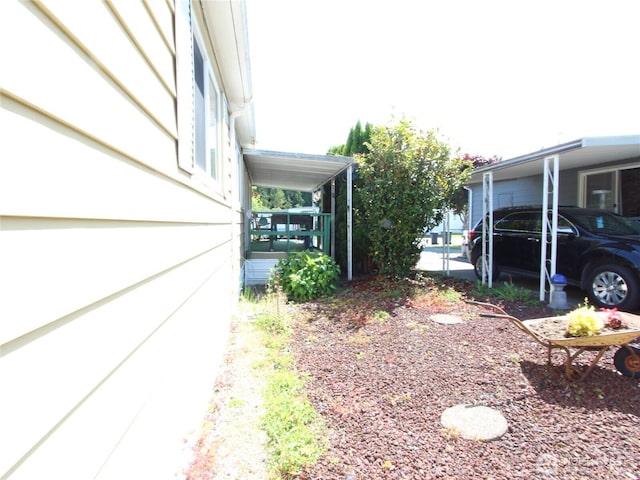 920 Maple Ln Unit 15, Sedro Woolley, WA 98284 - view of yard featuring an attached carport