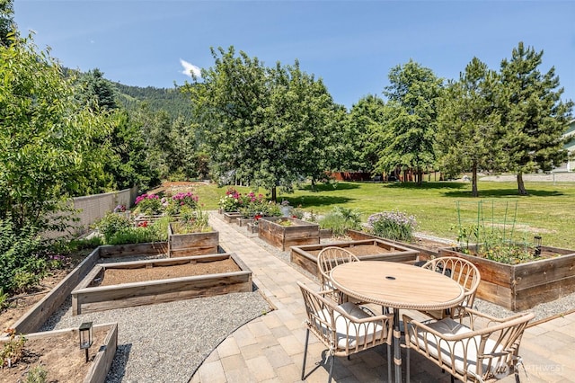 10303 Ski Hill Dr, Leavenworth, WA 98826 - view of patio featuring a garden and outdoor dining space