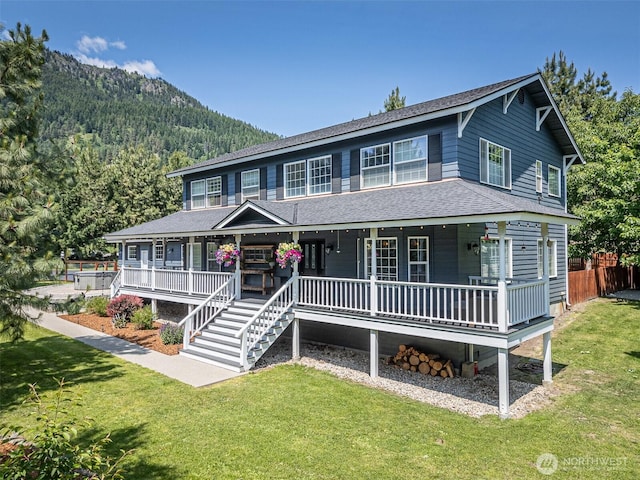 10303 Ski Hill Dr, Leavenworth, WA 98826 - view of front of home featuring covered porch, roof with shingles, and a forest view