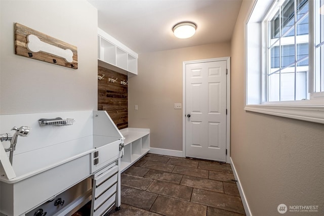 10303 Ski Hill Dr, Leavenworth, WA 98826 - mudroom with plenty of natural light and dark stone finish flooring