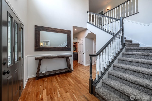 10303 Ski Hill Dr, Leavenworth, WA 98826 - foyer with stairway, wood finished floors, and a high ceiling