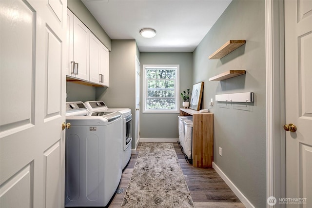 10303 Ski Hill Dr, Leavenworth, WA 98826 - laundry room featuring cabinet space, washing machine and dryer, and wood finished floors
