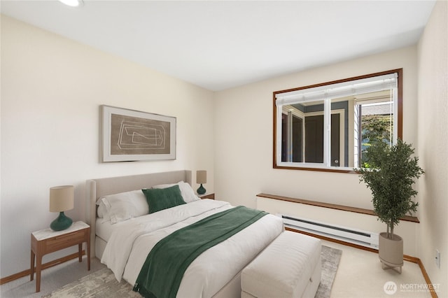 7581 Old Redmond Rd # 4, Redmond, WA 98052 - bedroom featuring a baseboard heating unit, baseboards, and carpet