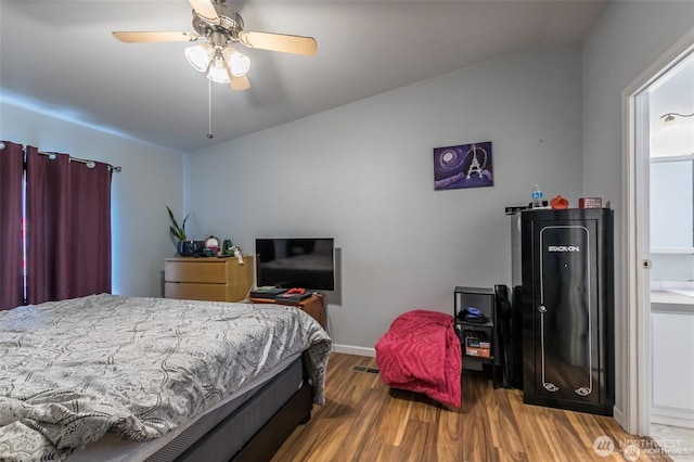16016 11th Ave E, Tacoma, WA 98445 - bedroom featuring wood finished floors, baseboards, and ceiling fan
