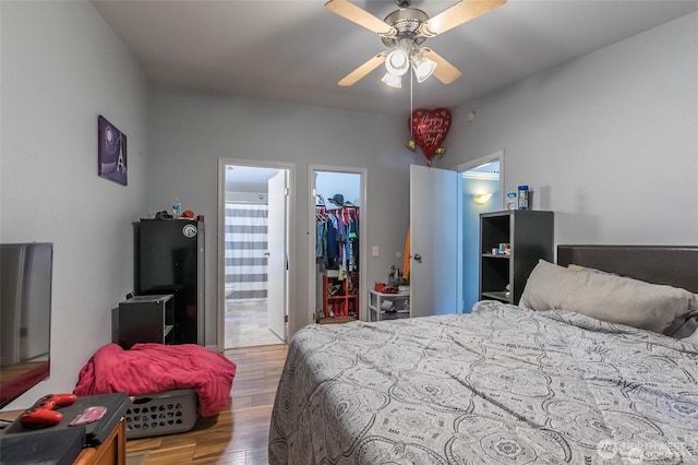 16016 11th Ave E, Tacoma, WA 98445 - bedroom featuring wood finished floors, a spacious closet, ensuite bath, and a closet