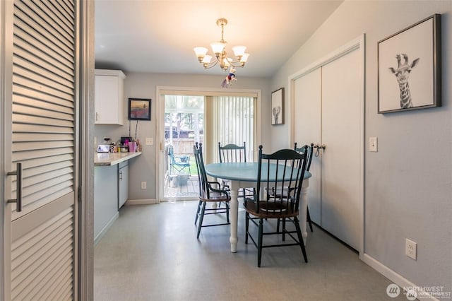 16016 11th Ave E, Tacoma, WA 98445 - dining area featuring a chandelier and baseboards