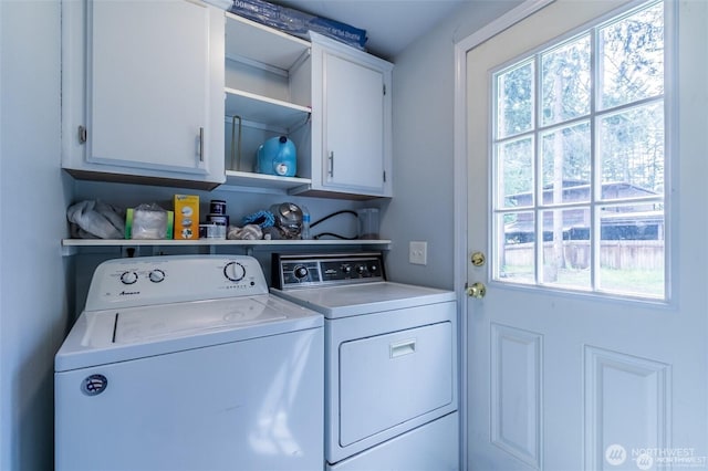 16016 11th Ave E, Tacoma, WA 98445 - laundry room with washer and clothes dryer, healthy amount of natural light, and cabinet space