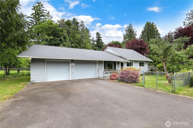 30524 56th Ave S, Auburn, WA 98001 - ranch-style home featuring a garage, driveway, roof with shingles, and view of scattered trees