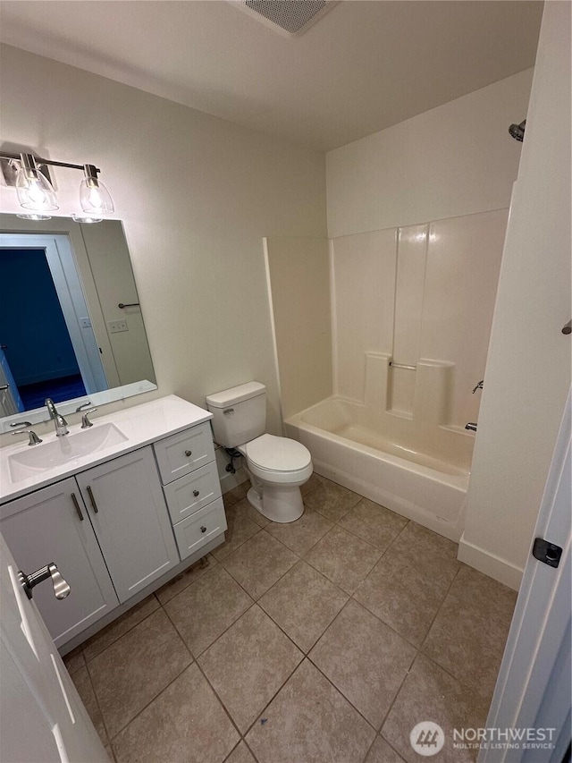 7041 E Washington St, Port Orchard, WA 98366 - full bathroom featuring vanity, toilet, shower / bathtub combination, and tile patterned flooring