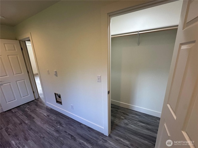 7041 E Washington St, Port Orchard, WA 98366 - unfurnished bedroom featuring dark wood-type flooring, baseboards, and a closet