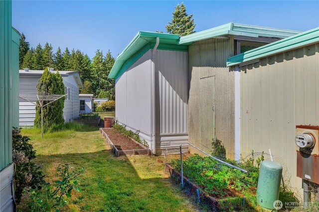 1700 E Shelton Springs Rd Unit 25, Shelton, WA 98584 - view of home's exterior featuring a garden and a yard