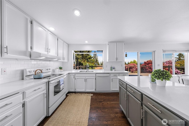 5030 155th Pl SE, Bellevue, WA 98006 - kitchen with white appliances, under cabinet range hood, healthy amount of natural light, and recessed lighting