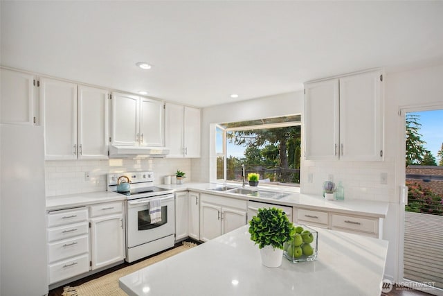 5030 155th Pl SE, Bellevue, WA 98006 - kitchen with white appliances, under cabinet range hood, decorative backsplash, white cabinets, and recessed lighting