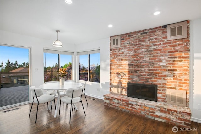 5030 155th Pl SE, Bellevue, WA 98006 - dining space with wood finished floors, healthy amount of natural light, a fireplace, and recessed lighting