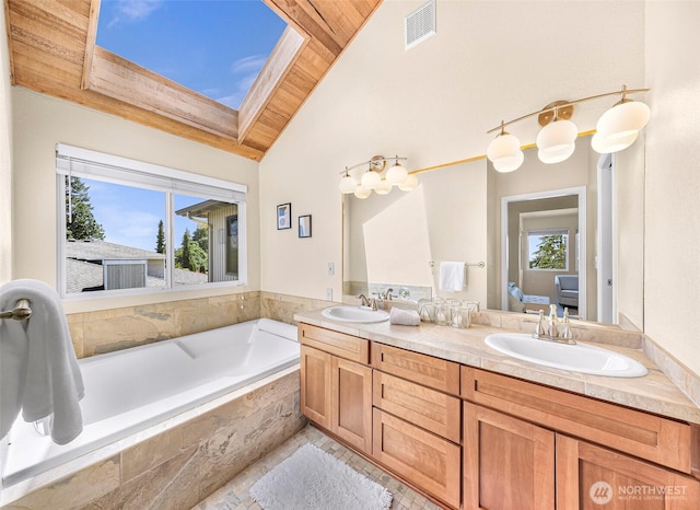 5030 155th Pl SE, Bellevue, WA 98006 - bathroom featuring wood ceiling, double vanity, a bath, vaulted ceiling, and connected bathroom