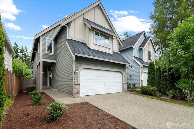 12611 13th Ave SE, Everett, WA 98208 - view of front facade with board and batten siding, driveway, an attached garage, a shingled roof, and brick siding