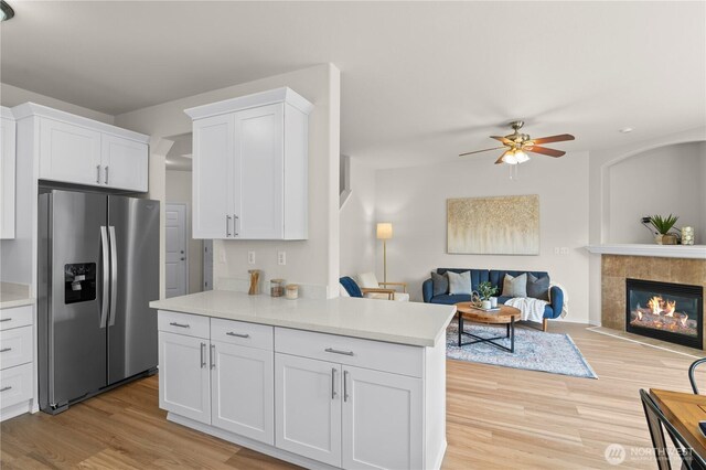 12611 13th Ave SE, Everett, WA 98208 - kitchen with stainless steel refrigerator with ice dispenser, light wood-type flooring, open floor plan, and light countertops