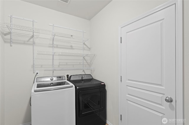 12611 13th Ave SE, Everett, WA 98208 - washroom with washer and clothes dryer and baseboards