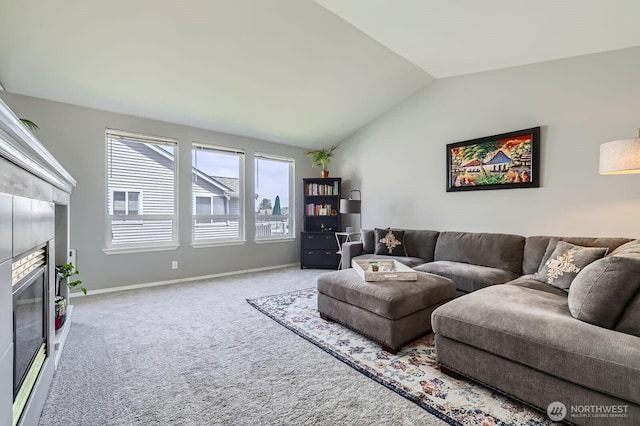 800 96th Ave NE Unit G201, Lake Stevens, WA 98258 - carpeted living area with lofted ceiling, a tiled fireplace, and baseboards