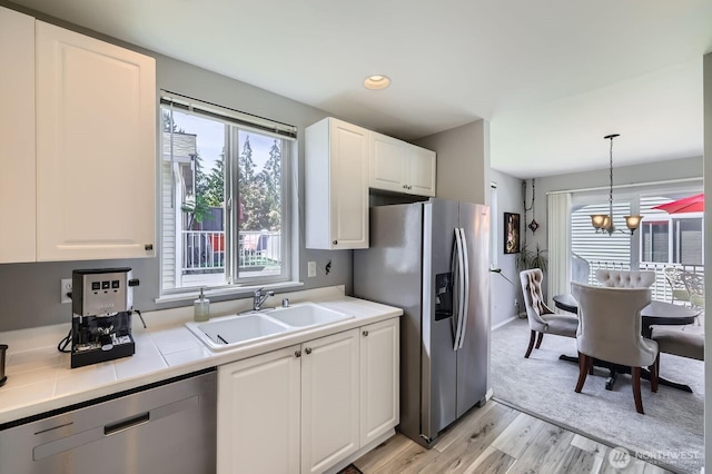 800 96th Ave NE Unit G201, Lake Stevens, WA 98258 - kitchen featuring appliances with stainless steel finishes, a sink, white cabinetry, and recessed lighting