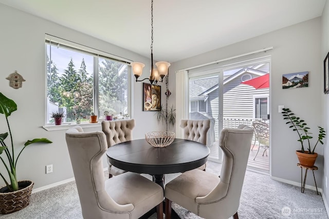 800 96th Ave NE Unit G201, Lake Stevens, WA 98258 - dining room featuring a chandelier, carpet, and baseboards