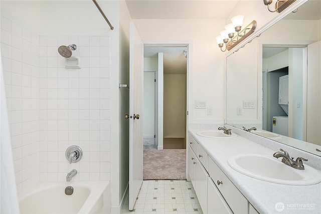 8823 Holly Dr Unit H207, Everett, WA 98208 - bathroom with stacked washing machine and dryer, double vanity, and  shower combination