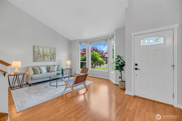 10704 25th Pl NE, Lake Stevens, WA 98258 - living area with light wood-style floors, baseboards, and vaulted ceiling