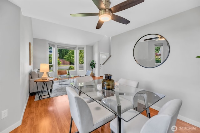 10704 25th Pl NE, Lake Stevens, WA 98258 - dining space featuring baseboards, light wood finished floors, and a ceiling fan