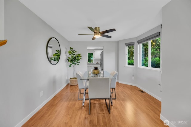 10704 25th Pl NE, Lake Stevens, WA 98258 - dining space featuring ceiling fan, baseboards, and light wood finished floors